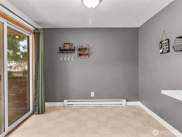 10818 108th St SW, Lakewood, WA 98498 - empty room with a baseboard heating unit and baseboards