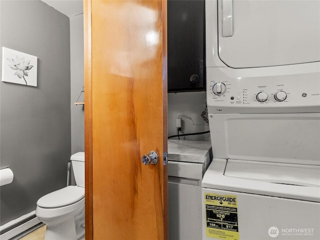 10818 108th St SW, Lakewood, WA 98498 - laundry area featuring a baseboard radiator and estacked washer and dryer
