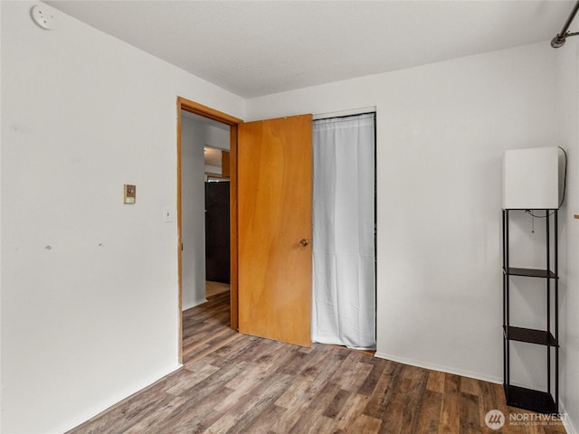 10818 108th St SW, Lakewood, WA 98498 - unfurnished bedroom with wood finished floors and a closet