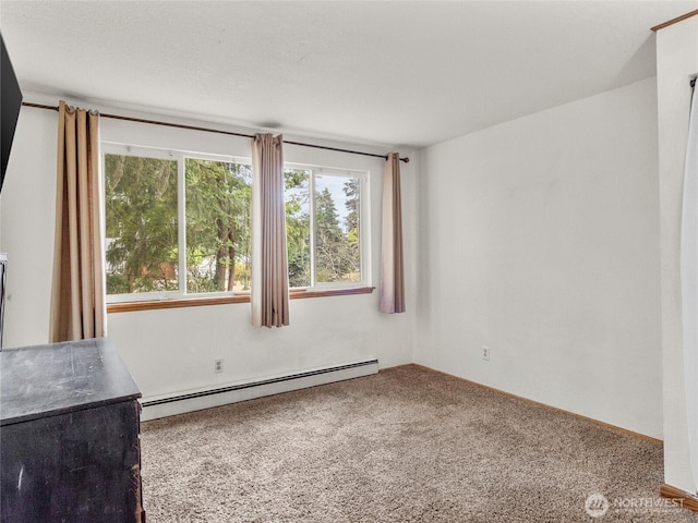 10818 108th St SW, Lakewood, WA 98498 - carpeted empty room featuring a baseboard heating unit and plenty of natural light
