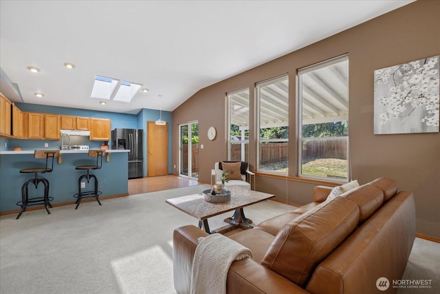 2420 Forest Ridge Dr SE, Auburn, WA 98002 - living room with a skylight, vaulted ceiling, and light carpet