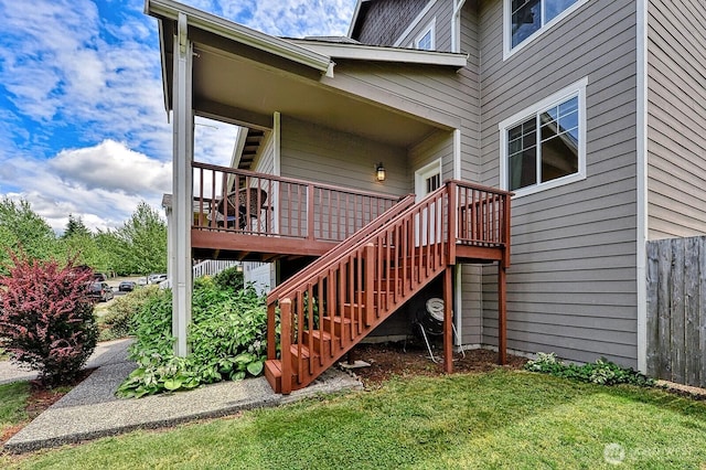 3606 Tree Farm Ct, Bellingham, WA 98226 - view of exterior entry with a lawn and a wooden deck
