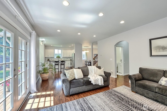 3606 Tree Farm Ct, Bellingham, WA 98226 - living area with arched walkways, recessed lighting, dark wood-type flooring, and stairs