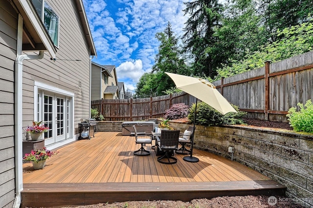 3606 Tree Farm Ct, Bellingham, WA 98226 - wooden deck with outdoor dining space, a grill, and a fenced backyard