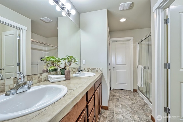 3606 Tree Farm Ct, Bellingham, WA 98226 - bathroom with double vanity, a stall shower, stone finish floors, and recessed lighting