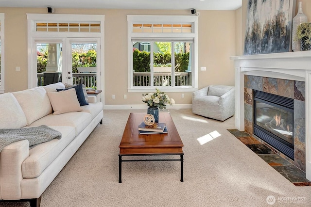 412 15th Ave, Kirkland, WA 98033 - carpeted living area featuring a tiled fireplace and baseboards