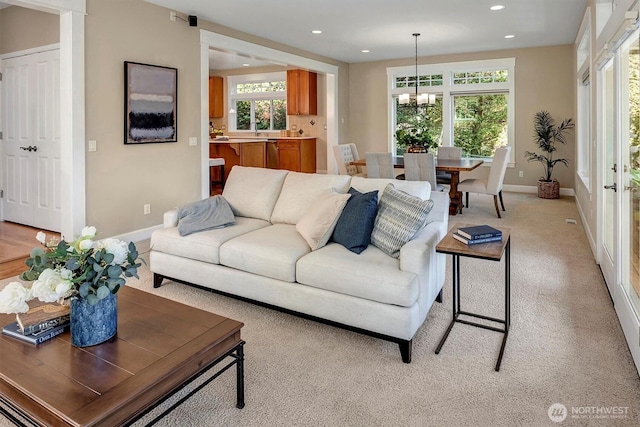 412 15th Ave, Kirkland, WA 98033 - living area with light colored carpet, recessed lighting, a chandelier, and plenty of natural light