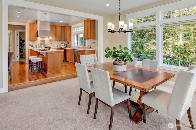 412 15th Ave, Kirkland, WA 98033 - dining area featuring a chandelier, recessed lighting, light colored carpet, and light wood-style floors