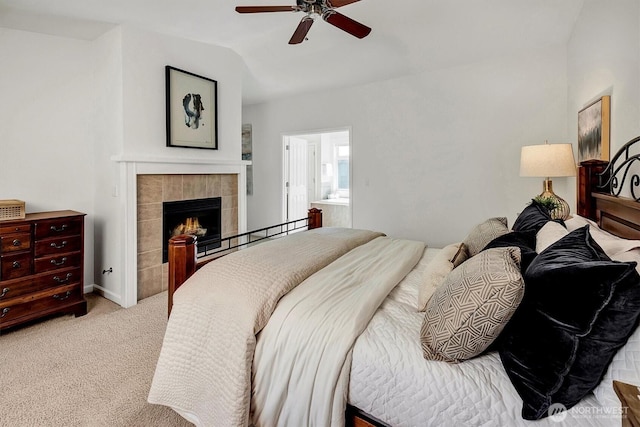412 15th Ave, Kirkland, WA 98033 - bedroom featuring a tiled fireplace, carpet, vaulted ceiling, and a ceiling fan