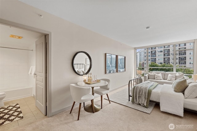2929 1st Ave Unit 721, Seattle, WA 98121 - bedroom with light tile patterned floors and ensuite bathroom