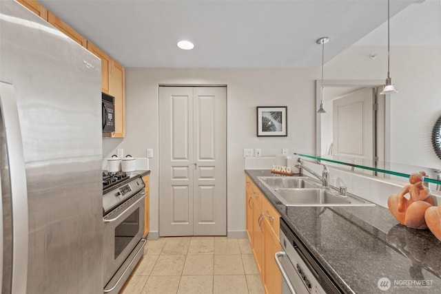 2929 1st Ave Unit 721, Seattle, WA 98121 - kitchen featuring appliances with stainless steel finishes, light brown cabinetry, light tile patterned floors, and decorative light fixtures