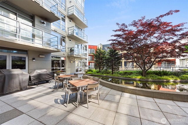 2929 1st Ave Unit 721, Seattle, WA 98121 - view of patio / terrace with a grill and outdoor dining space