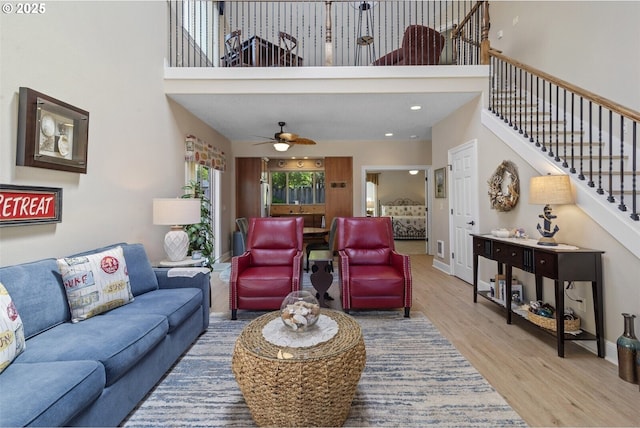 126 28th St NW, Long Beach, WA 98631 - living area with a high ceiling, wood finished floors, stairs, and ceiling fan