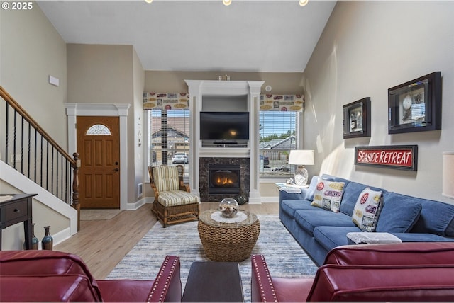 126 28th St NW, Long Beach, WA 98631 - living area featuring wood finished floors, a fireplace, and stairway