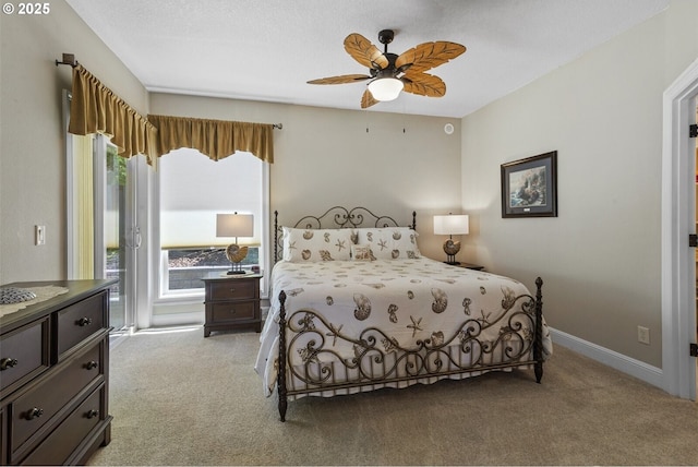 126 28th St NW, Long Beach, WA 98631 - bedroom with light colored carpet, access to outside, and a ceiling fan