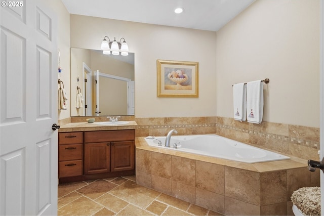 126 28th St NW, Long Beach, WA 98631 - full bath featuring vanity, a garden tub, stone tile flooring, and recessed lighting