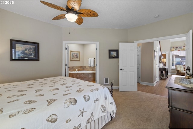 126 28th St NW, Long Beach, WA 98631 - carpeted bedroom with ensuite bathroom and a ceiling fan
