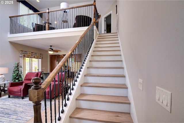 126 28th St NW, Long Beach, WA 98631 - stairway featuring a towering ceiling and a ceiling fan