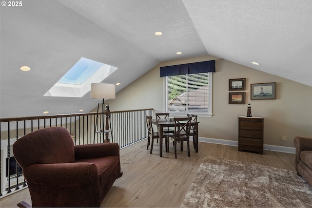 126 28th St NW, Long Beach, WA 98631 - living area with a skylight, wood finished floors, lofted ceiling, a textured ceiling, and recessed lighting