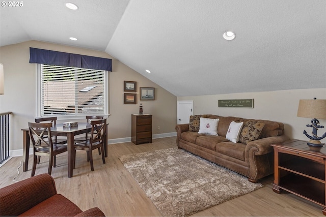 126 28th St NW, Long Beach, WA 98631 - living room featuring light wood-style floors and lofted ceiling