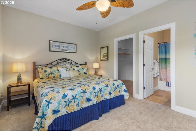 126 28th St NW, Long Beach, WA 98631 - bedroom with carpet flooring, a walk in closet, and a ceiling fan