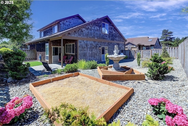126 28th St NW, Long Beach, WA 98631 - rear view of property with a patio and a fenced backyard