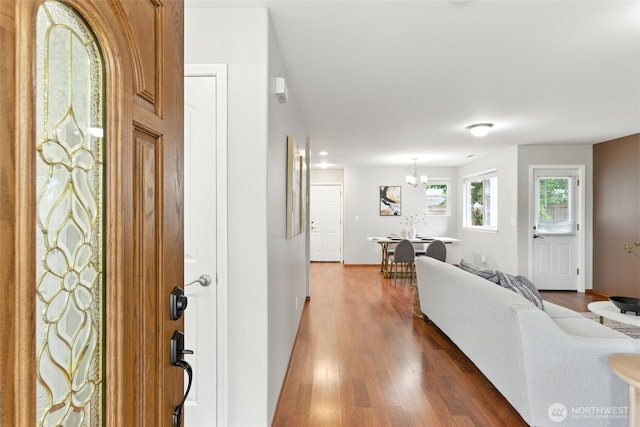 7436 S G St, Tacoma, WA 98408 - entryway with a chandelier and dark wood-style floors