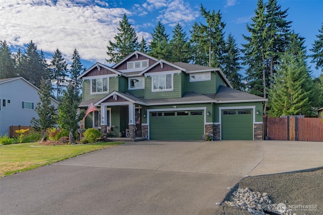 4831 Skylark St NE, Olympia, WA 98516 - craftsman-style home featuring stone siding, driveway, covered porch, a garage, and board and batten siding
