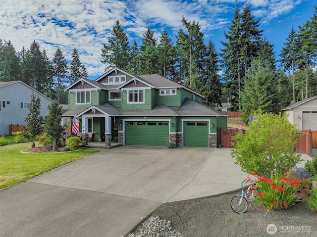 4831 Skylark St NE, Olympia, WA 98516 - craftsman inspired home featuring stone siding, driveway, and a garage