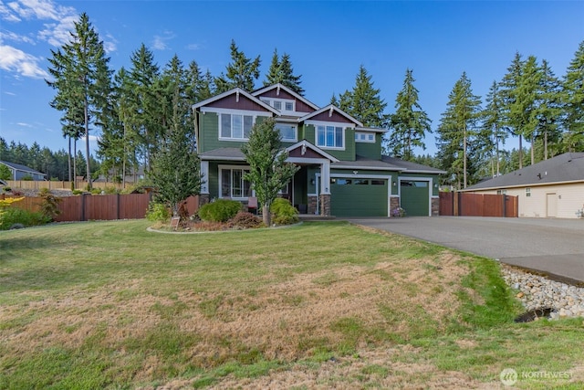 4831 Skylark St NE, Olympia, WA 98516 - craftsman-style home with asphalt driveway, an attached garage, and stone siding