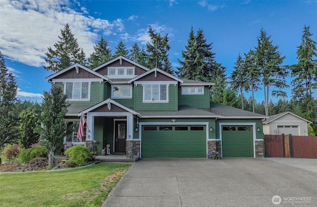 4831 Skylark St NE, Olympia, WA 98516 - craftsman house featuring stone siding, concrete driveway, a porch, and an attached garage