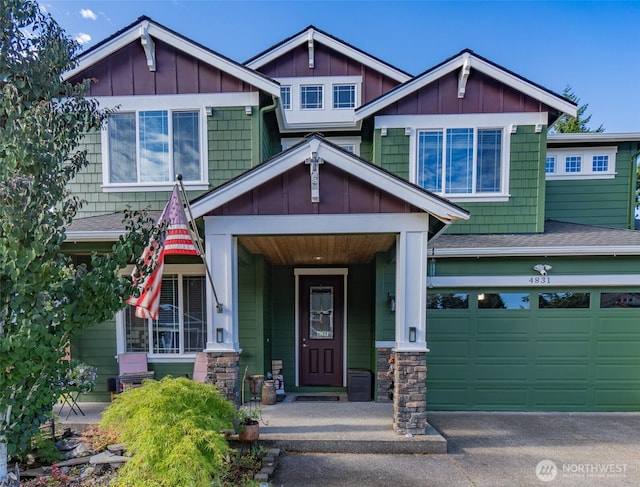 4831 Skylark St NE, Olympia, WA 98516 - craftsman house with a garage, board and batten siding, a porch, driveway, and stone siding