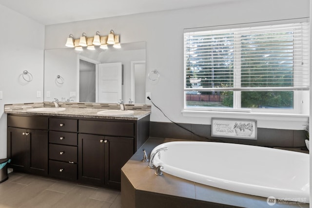 4831 Skylark St NE, Olympia, WA 98516 - bathroom featuring plenty of natural light, a tub, double vanity, and tile patterned floors