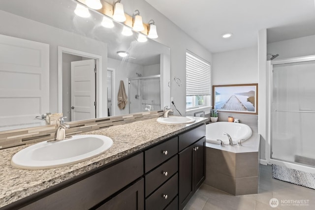 4831 Skylark St NE, Olympia, WA 98516 - bathroom featuring a stall shower, double vanity, a garden tub, and tile patterned flooring