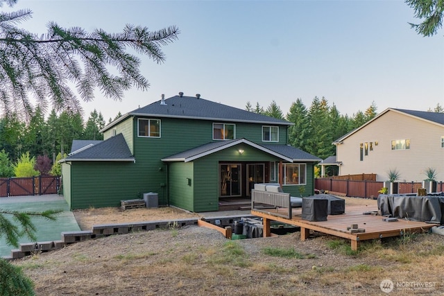 4831 Skylark St NE, Olympia, WA 98516 - back of house featuring a wooden deck, a fenced backyard, and an outdoor hangout area