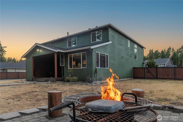 4831 Skylark St NE, Olympia, WA 98516 - back of house at dusk with a fire pit