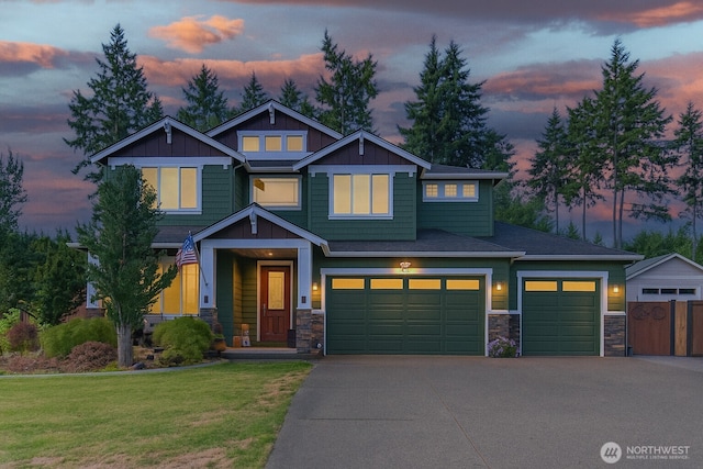 4831 Skylark St NE, Olympia, WA 98516 - craftsman-style home featuring stone siding, driveway, board and batten siding, and a garage