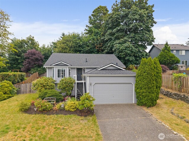 25920 202nd Ave SE, Covington, WA 98042 - view of front of property with asphalt driveway, a garage, and a shingled roof