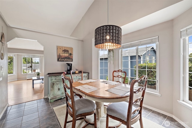 25920 202nd Ave SE, Covington, WA 98042 - dining space with plenty of natural light, tile patterned floors, high vaulted ceiling, and a chandelier