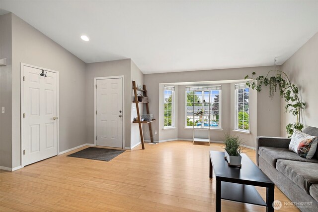 25920 202nd Ave SE, Covington, WA 98042 - entryway with light wood-style flooring, lofted ceiling, and recessed lighting
