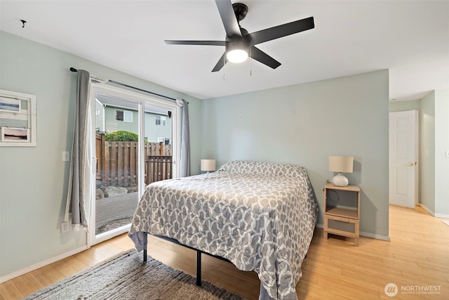 25920 202nd Ave SE, Covington, WA 98042 - bedroom featuring access to outside, light wood-type flooring, and ceiling fan