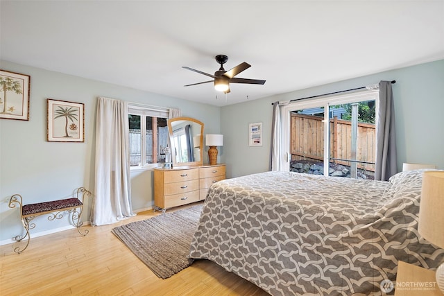 25920 202nd Ave SE, Covington, WA 98042 - bedroom featuring access to outside, wood finished floors, and ceiling fan