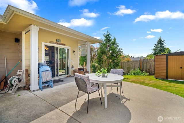 1918 Tundra Loop, Mount Vernon, WA 98273 - view of patio / terrace with outdoor dining space and a storage shed