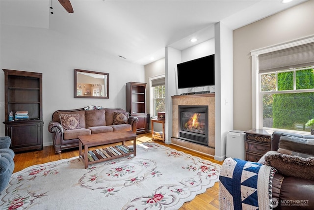 1918 Tundra Loop, Mount Vernon, WA 98273 - living area featuring a tile fireplace, healthy amount of natural light, wood finished floors, and recessed lighting