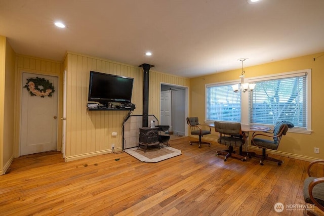 1427 E 3rd St, Port Angeles, WA 98362 - living room featuring a wood stove, light wood-type flooring, a chandelier, and recessed lighting