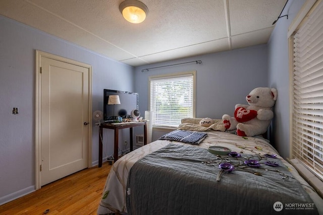 1427 E 3rd St, Port Angeles, WA 98362 - bedroom with light wood-type flooring and baseboards