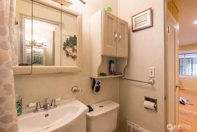 1427 E 3rd St, Port Angeles, WA 98362 - bathroom featuring a sink and wood finished floors