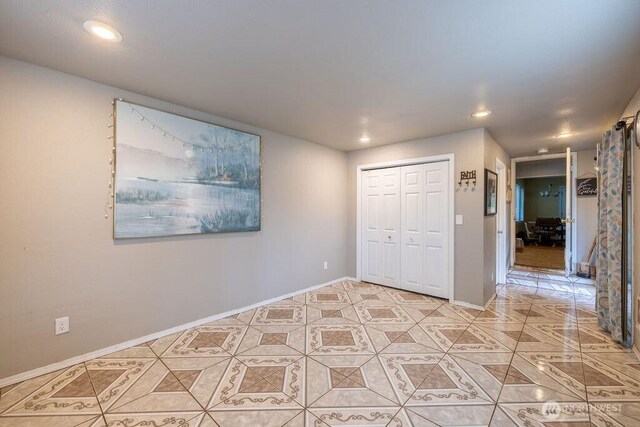 1427 E 3rd St, Port Angeles, WA 98362 - unfurnished bedroom with recessed lighting, light tile patterned flooring, and a closet
