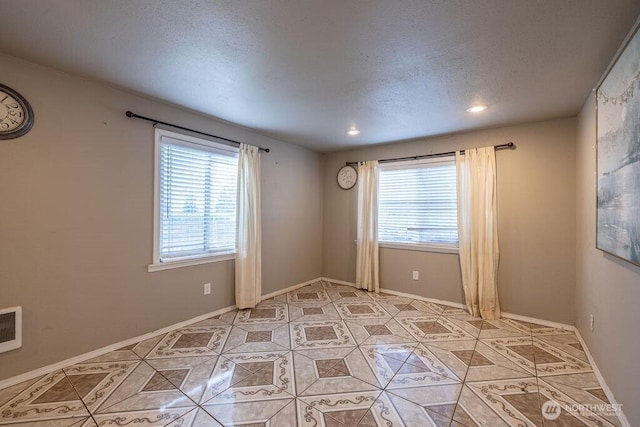 1427 E 3rd St, Port Angeles, WA 98362 - unfurnished room featuring light tile patterned floors and recessed lighting