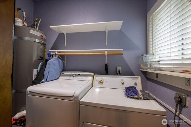 1427 E 3rd St, Port Angeles, WA 98362 - laundry room featuring washing machine and dryer and secured water heater
